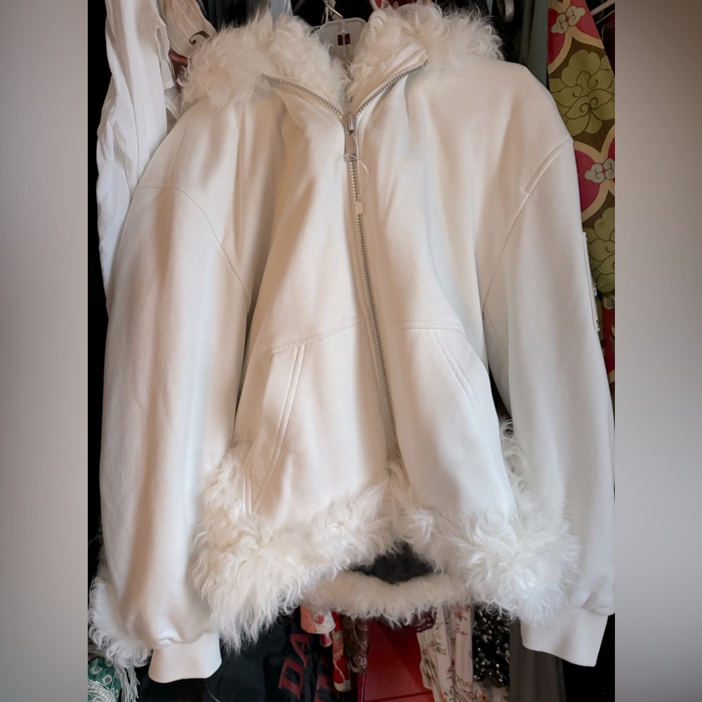 Winter coat/hoodie. White  mooseknuckles jacket with fur detail and trim.